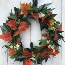 Load image into Gallery viewer, Autumn Wreath Rich russet maple leaves and lush green laurel, sprinkled with wild hydrangeas are stunning on this beautiful Autumn wreath. Looks gorgeous on both light and dark coloured doors. Bring a a touch of Autumn colour to your front door this season. This everlasting wreath can be enjoyed year after year.