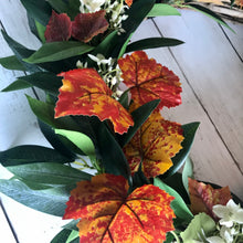 Load image into Gallery viewer, Autumn Wreath Rich russet maple leaves and lush green laurel, sprinkled with wild hydrangeas are stunning on this beautiful Autumn wreath. Looks gorgeous on both light and dark coloured doors. Bring a a touch of Autumn colour to your front door this season. This everlasting wreath can be enjoyed year after year.