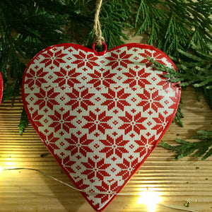 A festive themed assortment of 3 metal hanging hearts, each decorated with a traditional red and white print   Perfect for hanging around the home or on your tree at Christmas time 